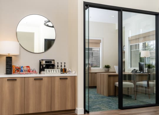 a room with a bar and a mirror and a dining room