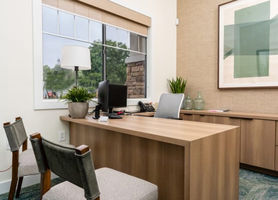 a office with a desk and a window