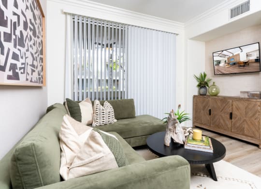 2-Bedroom Apartments in Rancho Cucamonga, CA - Camino Real - Living Room with Wood-Style Flooring and Sliding Door to Patio