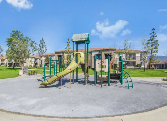 Luxury Apartments for Rent in Rancho Cucamonga, CA - Camino Real - Private Playground with Slide, Grass, and Picnic Table