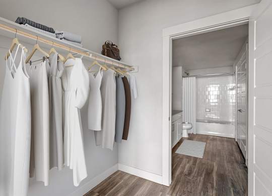 Gateway Arvada Ridge Walk-In Closet with Custom Shelving and Ample Storage Space