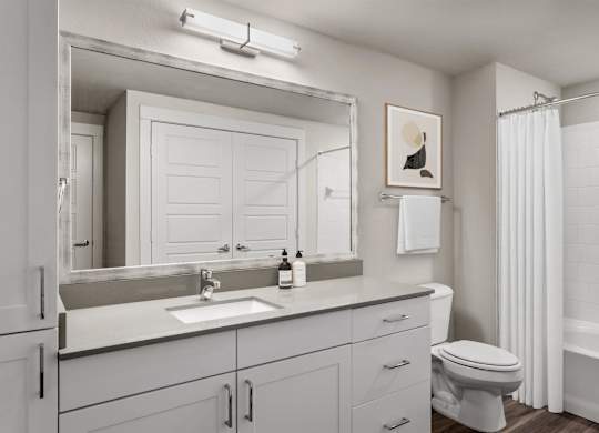 Gateway Arvada Ridge Spacious Bathroom with Large Vanity and Bright Lighting