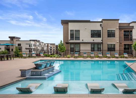 Gateway Arvada Ridge Sparkling Pool with In-Pool Loungers and Relaxing Deck Seating
