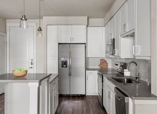 Gateway Arvada Ridge Open Kitchen with Stainless Steel Appliances and Ample Cabinetry