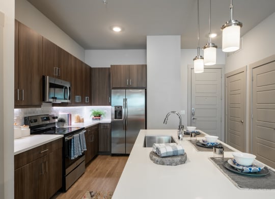 Modern Kitchen Featuring Breakfast Bar and Wood-Style Flooring