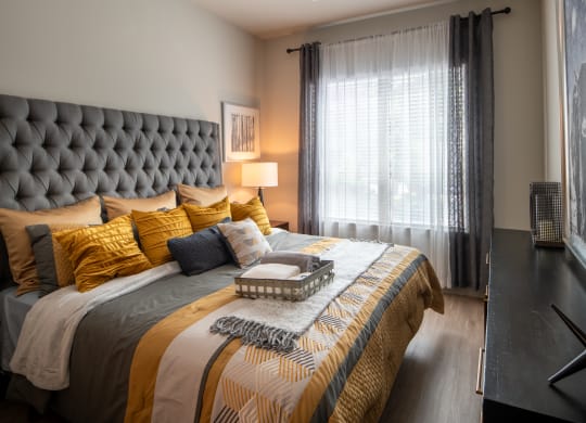 Comfortable Bedroom with Accent Lighting and Decorative Art