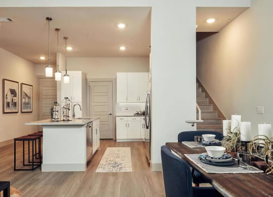 Open Kitchen and Dining Area with Upstairs Loft Access