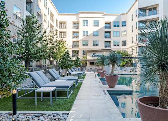 Poolside Sundeck with Lounge Chairs and Modern Landscaping Features