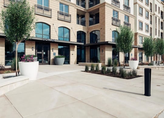 Entrance to Domain at The Gate with Grand Arched Windows and Landscaped Walkway