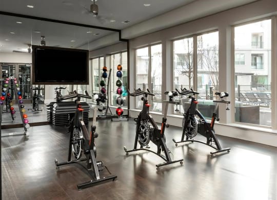 Bright Spin Studio Featuring Indoor Bikes, Large TV, and Scenic Outdoor Views