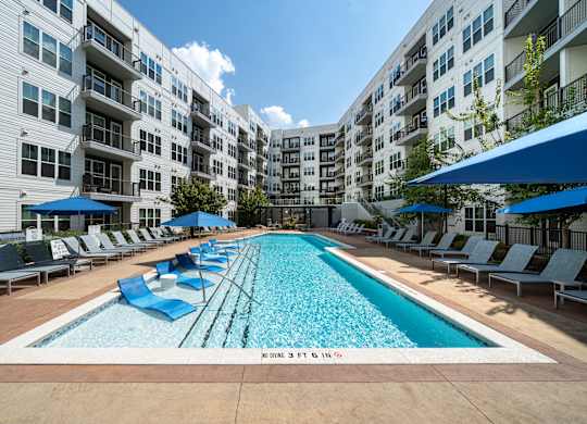 A large swimming pool in a residential complex.