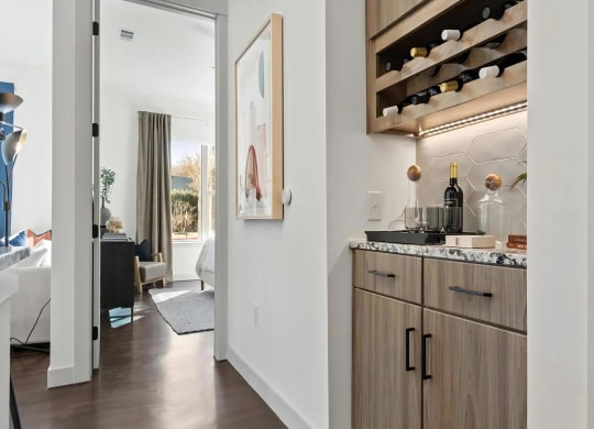 In-Unit Dry Bar with Granite Countertop and Wine Bottle Storage