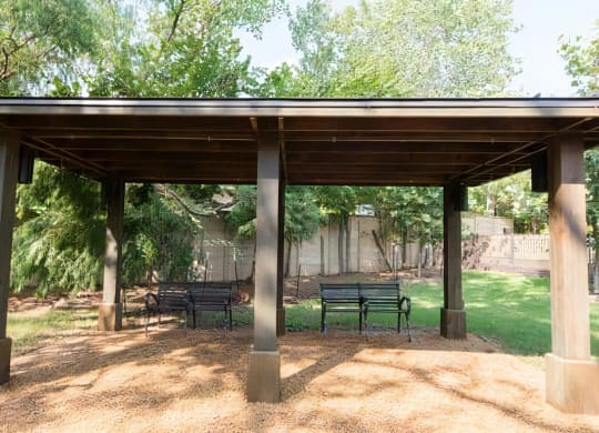 Outdoor Pavilion with Multiple Benches in Community Green Space