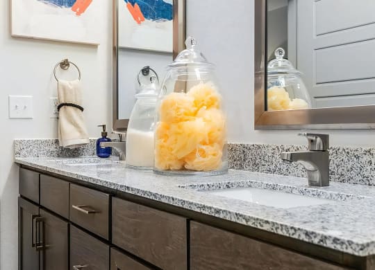 Elegant Granite-Topped Double Vanities with Undermount Sinks