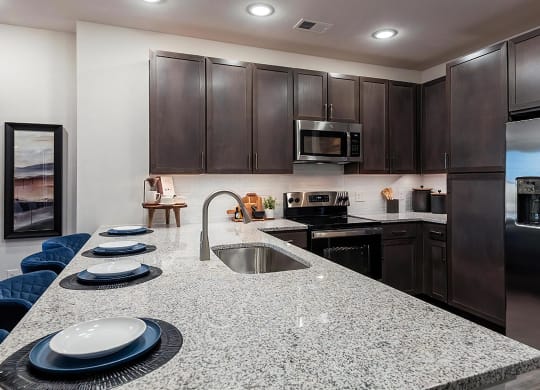 Sleek Kitchen Featuring Built-In Pantry Cabinets and Stainless Steel Finishes