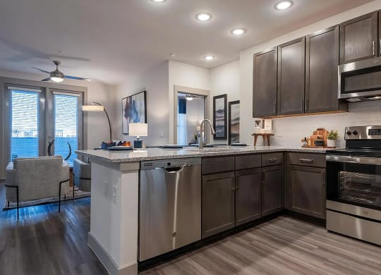 Stylish Kitchen with Dark Wood Cabinets and White Subway Tile Backsplash