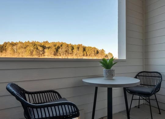 Private Apartment Patio with Outdoor Seating and Scenic Views