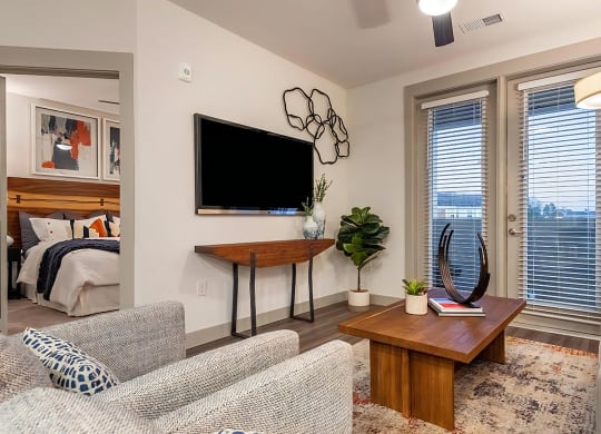 Inviting Living Room with Wall-Mounted TV and Modern Decor