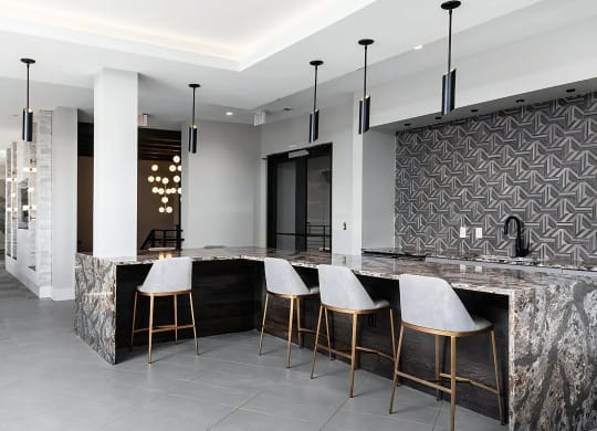 Multi-Use Community Lounge with Game Tables and Bar Area