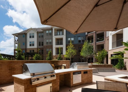 Dual Community Grilling Stations in Outdoor Kitchen Setting