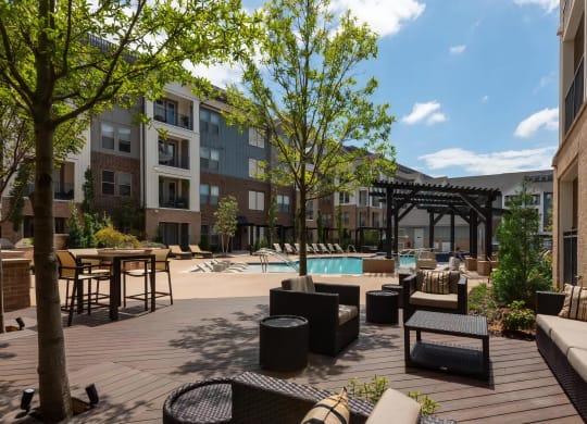 Shaded Seating Area with Comfortable Furniture Near Pool Deck