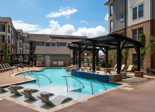 Sleek Poolside Escape with Umbrella Loungers and Water Jets