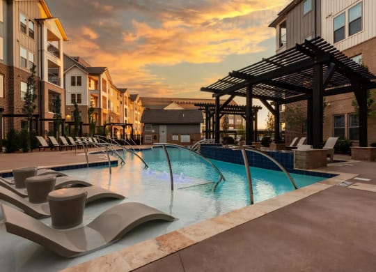 Sunset Views Over Resort-Style Pool with In-Water Seating