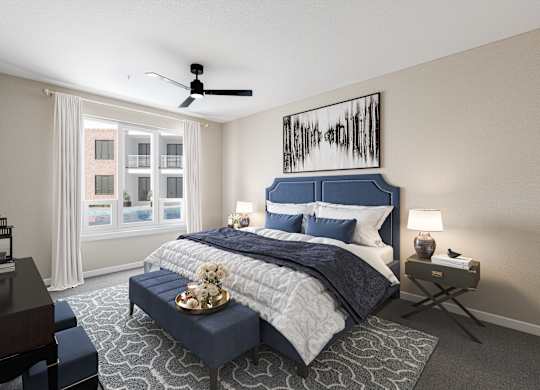 a bedroom with a blue and white bed and a ceiling fan