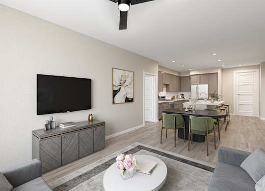 a living room and dining room with a tv and a kitchen