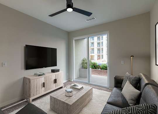 a living room with a couch and a coffee table and a tv