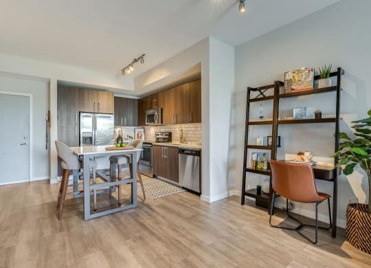 Kitchen and Dining Area with Built-In Shelves and Compact Work Desk