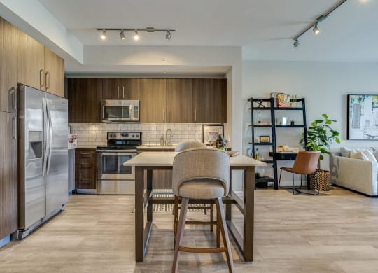 Open Kitchen with Island Seating and View into Living Room