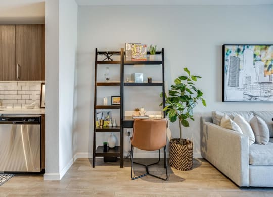 Living Room with In-Home Workspace with Bookshelves and Chair