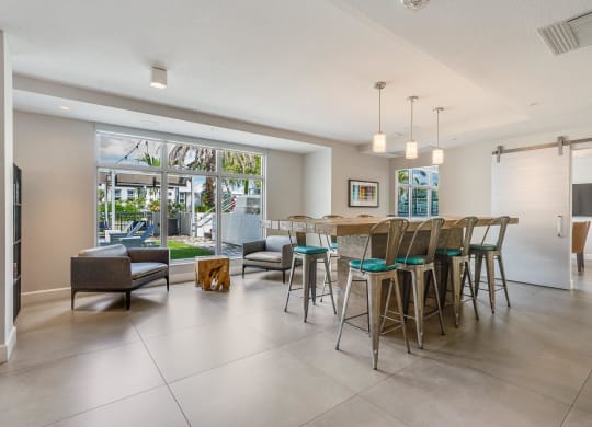 Clubhouse Community Room with Long Table and Outdoor Access