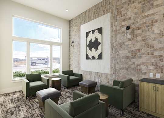 a lobby with couches and chairs and a large window