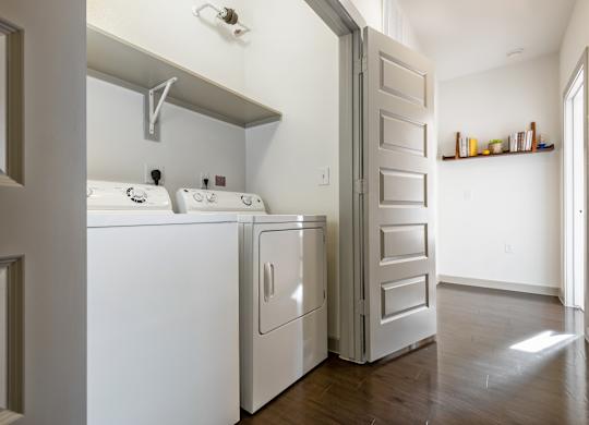 A white washer and dryer in a laundry room.