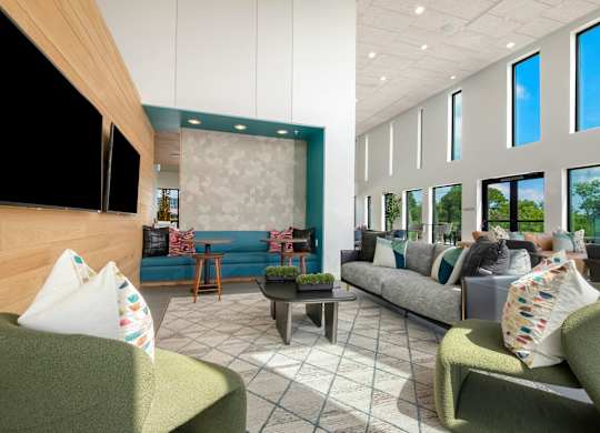 Modern Resident Lounge with Built-In Banquette and Cozy Seating