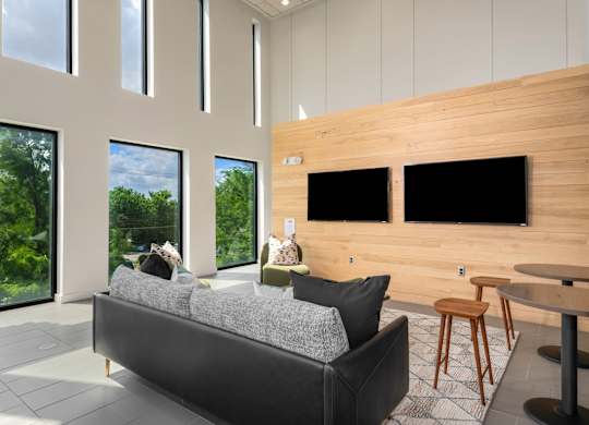 Lounge Featuring TV Wall, Built-In Bench, and Decorative Wood Paneling