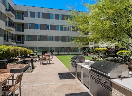 Outdoor Green Space with Grills and Lounge Seating