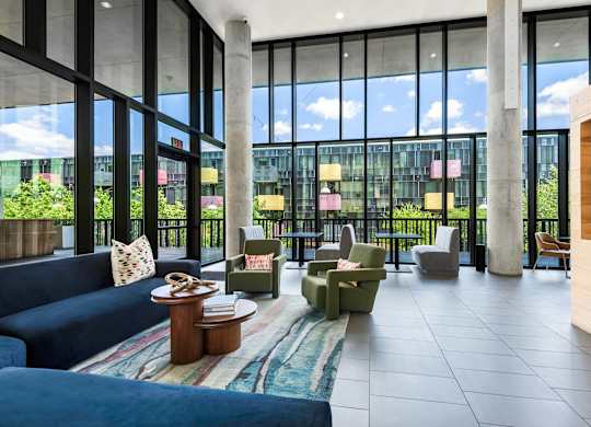 Indoor Lounge Overlooking Courtyard with Sectionals and Chair Seating
