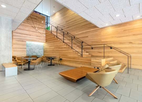 Contemporary Lobby Lounge with Statement Wood Staircase
