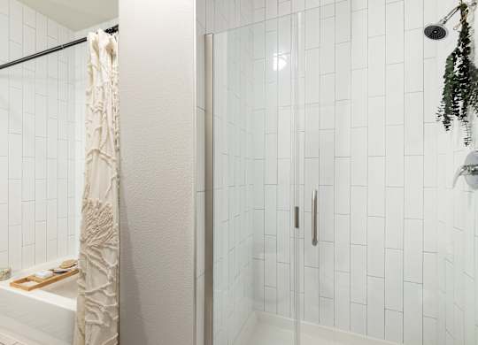 Glass-Enclosed Shower with Vertical Subway Tile Design