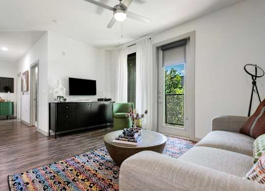 Bright Living Room with Modern Decor and Balcony Access