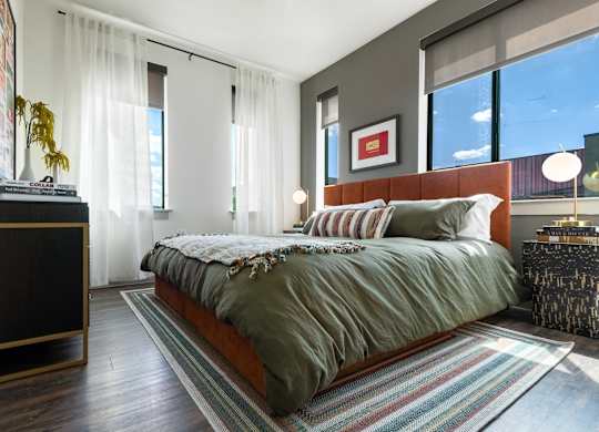 Spacious Bedroom with Plenty of Natural Light and Wood Flooring
