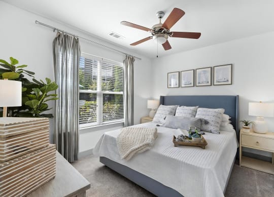 Spacious Bedroom with Ceiling Fan and Plush Carpeting