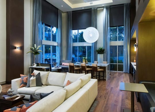 Resident Lounge with Gathering Table and High Ceilings