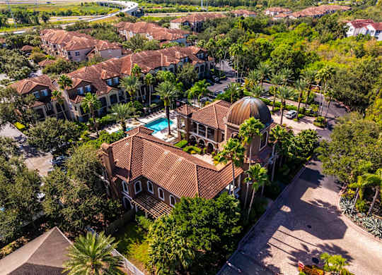 Elevated aerial of clubhouse with domed roof and landscaped courtyard