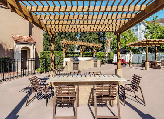 Outdoor grilling and dining pergolas with tables and seating