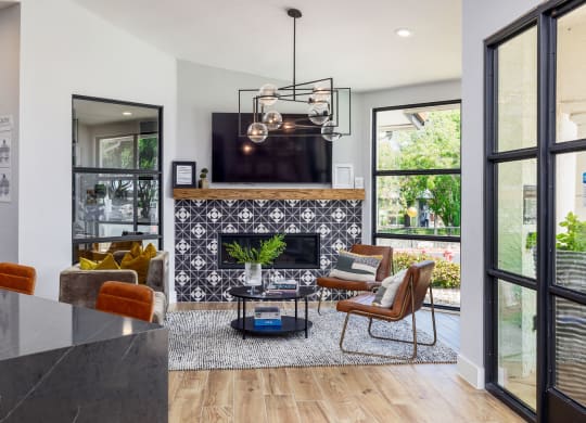 a living room with a fireplace and a tv on the wall