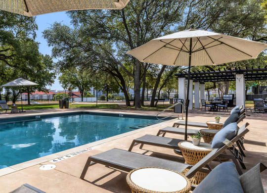 Mesa Verde Pool Second Pool with Sunbathing Loungers Shade Umbrellas and Adjacent Outdoor Covered Lounge